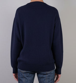 Woman wearing a navy cashmere crew jumper 