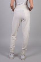 Woman wearing cream cashmere joggers 