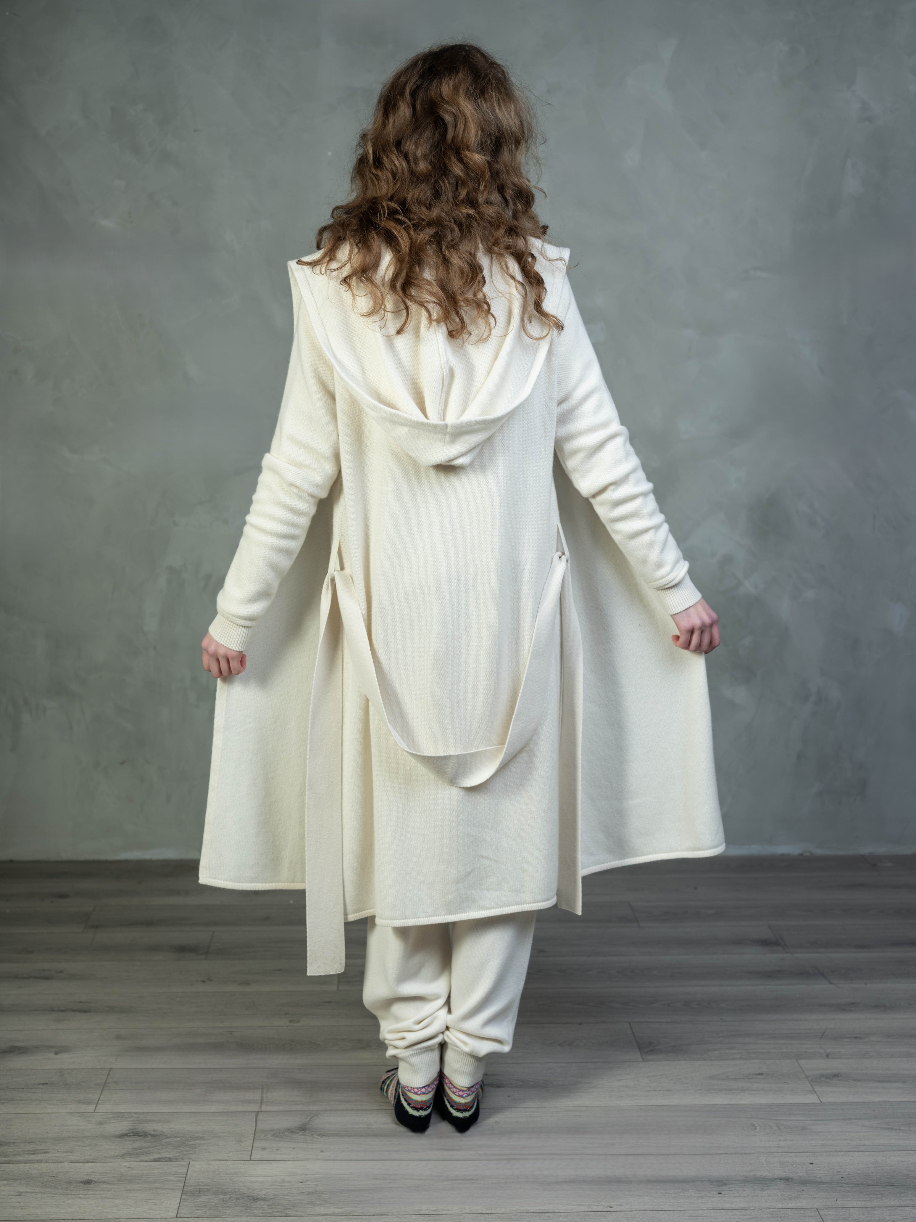 model wearing luxury Cashmere hooded yacht wrap cream and cream cashmere joggers